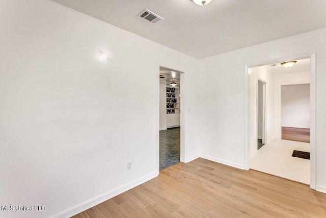 empty room with light hardwood / wood-style floors