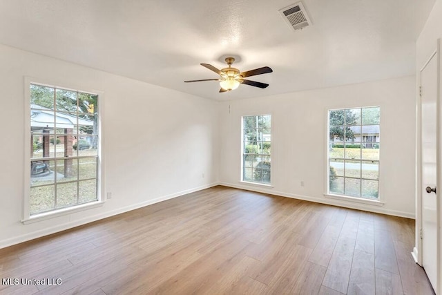 unfurnished room featuring ceiling fan and light hardwood / wood-style flooring