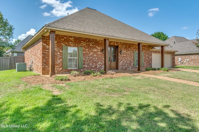 view of front of house featuring a front yard and a garage