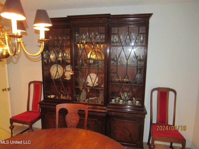 dining space featuring a notable chandelier