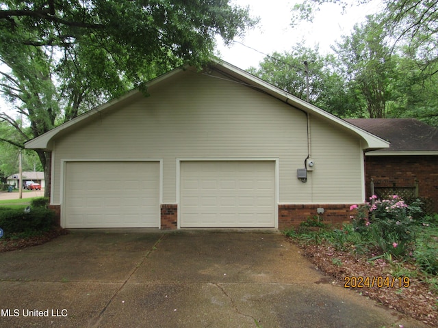 view of side of property with a garage