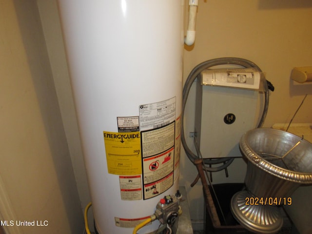 utility room featuring gas water heater