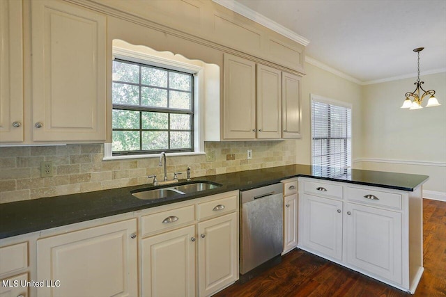 kitchen with dark countertops, stainless steel dishwasher, ornamental molding, a sink, and a peninsula