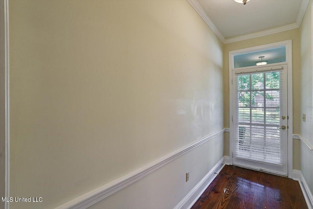 doorway featuring dark wood-type flooring, baseboards, and ornamental molding