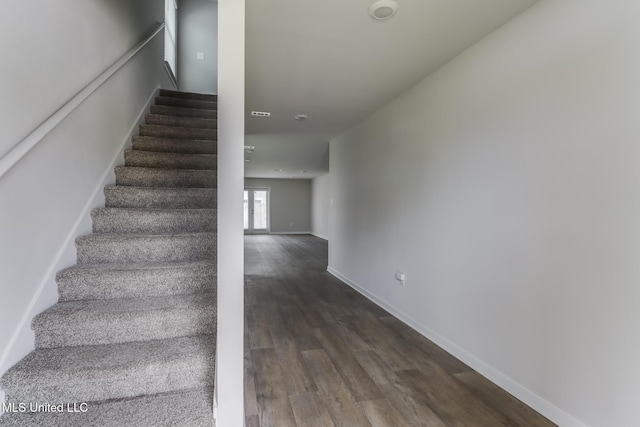 2016 Carondelet St, Ocean Springs, MS 39564 - stairs featuring wood finished floors and baseboards