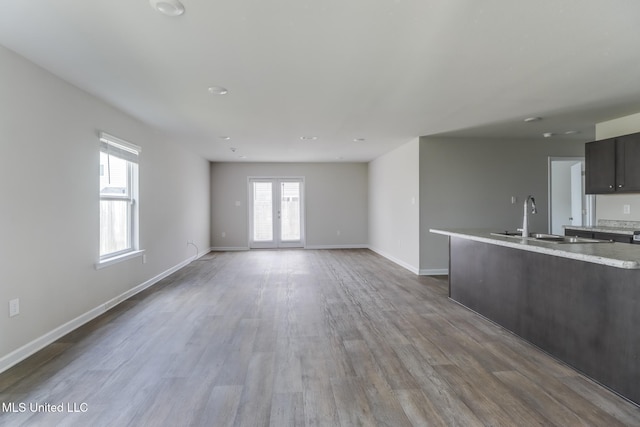 2016 Carondelet St, Ocean Springs, MS 39564 - unfurnished living room featuring a sink and wood finished floors