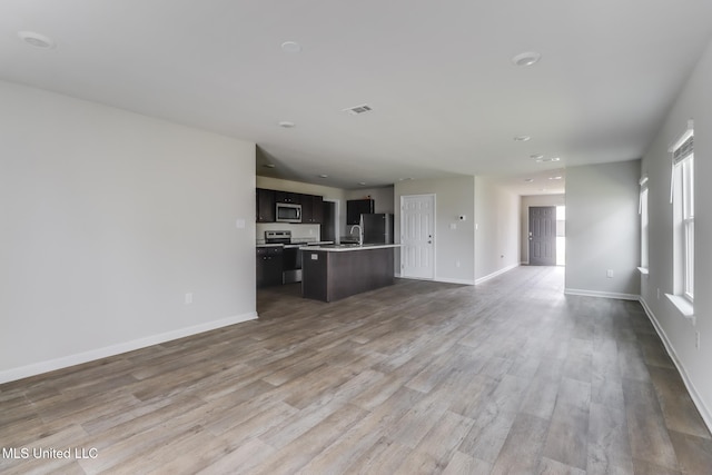2016 Carondelet St, Ocean Springs, MS 39564 - unfurnished living room with wood finished floors and baseboards