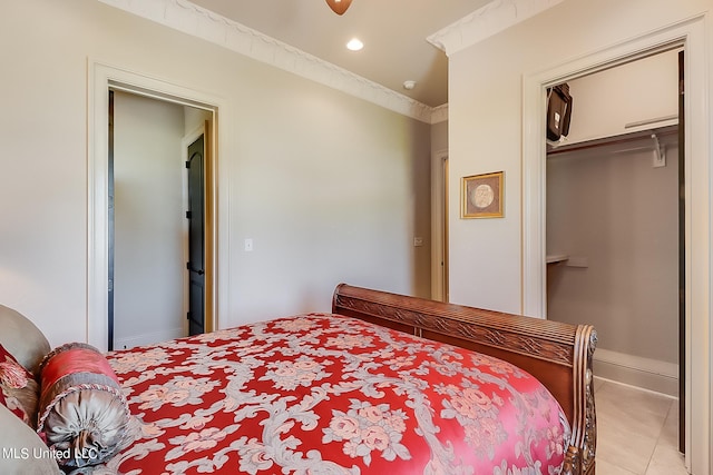 bedroom with a closet and light tile patterned floors