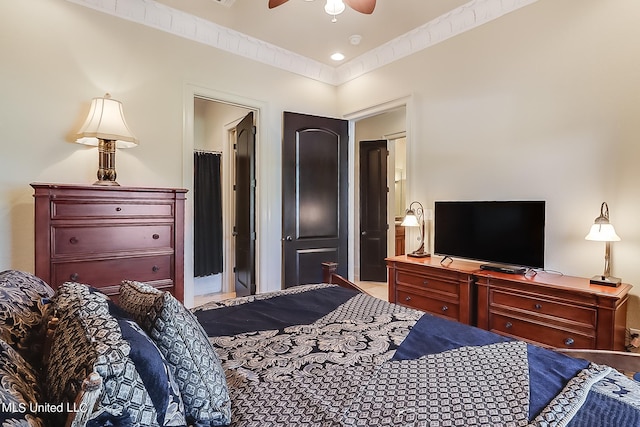 bedroom with connected bathroom and ceiling fan