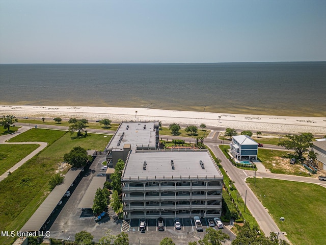 birds eye view of property featuring a water view and a view of the beach