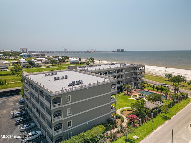 birds eye view of property featuring a water view and a view of the beach