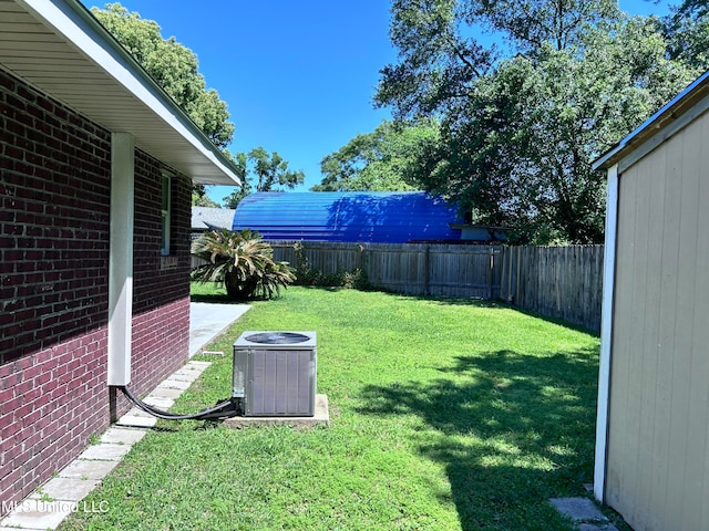 view of yard with central AC unit