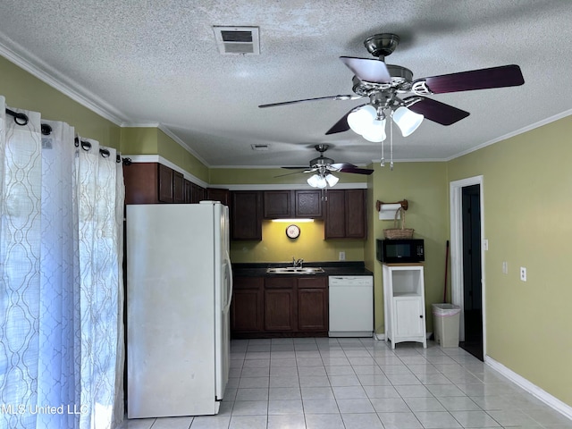 kitchen with white appliances, a textured ceiling, ornamental molding, and sink