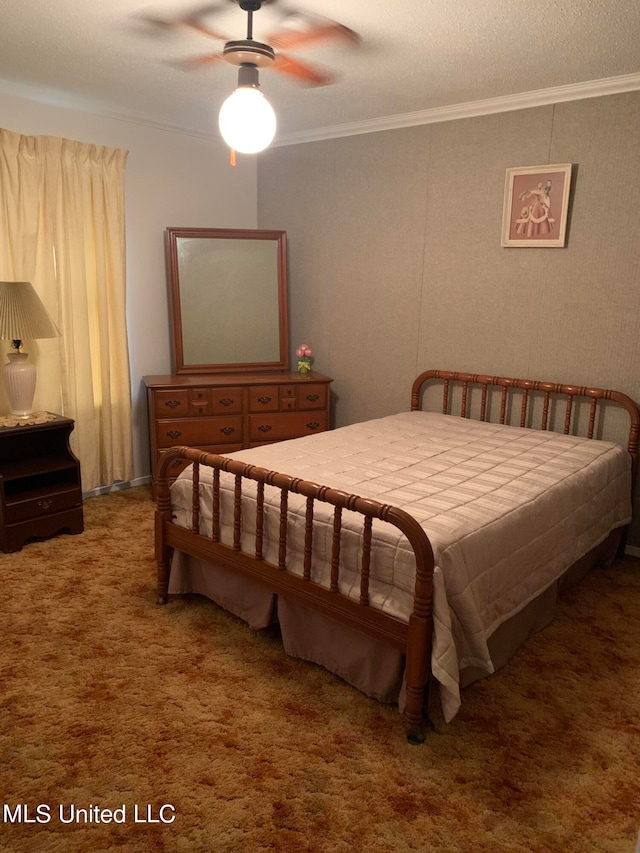 carpeted bedroom with ornamental molding, a textured ceiling, and ceiling fan