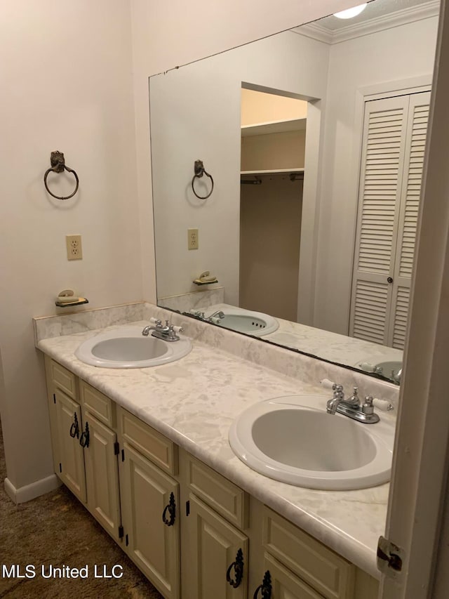 bathroom featuring vanity and ornamental molding