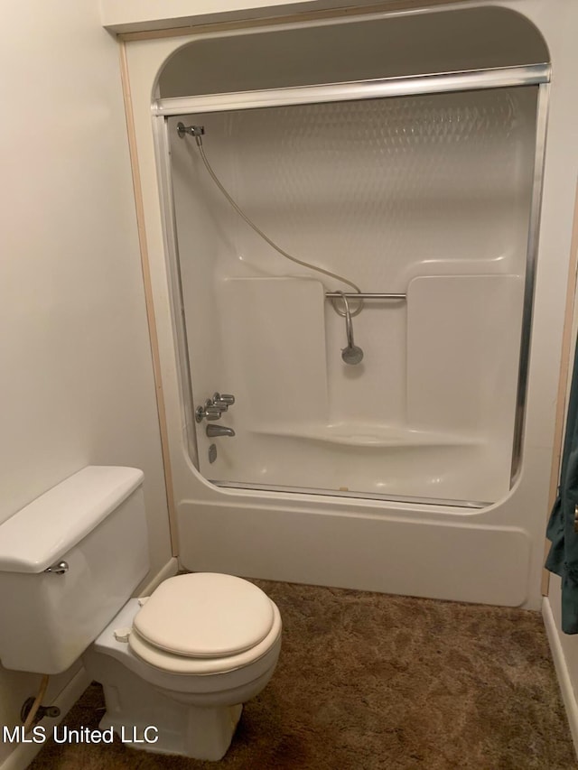 bathroom featuring tub / shower combination and toilet