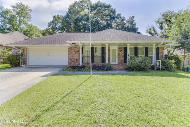 8921 Hanalei Cir, Diamondhead, MS 39525 - single story home with brick siding, an attached garage, a front lawn, concrete driveway, and a porch