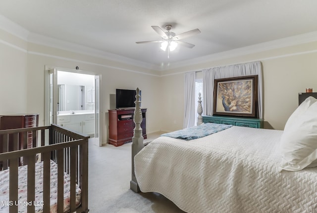 8921 Hanalei Cir, Diamondhead, MS 39525 - bedroom featuring light carpet, crown molding, ceiling fan, and connected bathroom