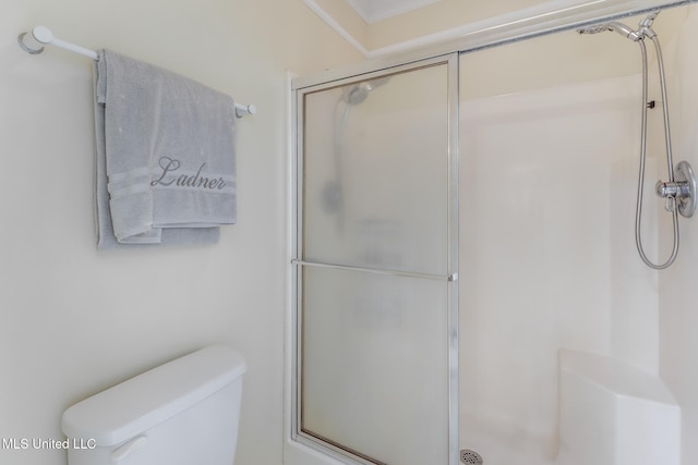 8921 Hanalei Cir, Diamondhead, MS 39525 - full bathroom featuring a shower with door and toilet