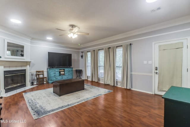 8921 Hanalei Cir, Diamondhead, MS 39525 - living room with ceiling fan, ornamental molding, a tile fireplace, and wood finished floors