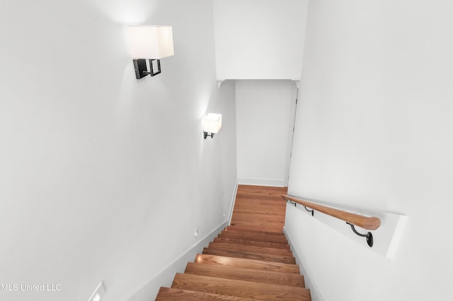 stairs with wood finished floors