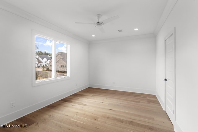 unfurnished room featuring crown molding, light wood finished floors, recessed lighting, and baseboards