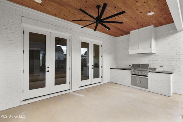 view of patio featuring exterior kitchen, french doors, ceiling fan, and grilling area