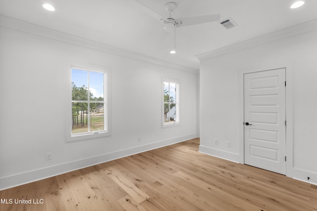 unfurnished room with ornamental molding, recessed lighting, visible vents, and plenty of natural light