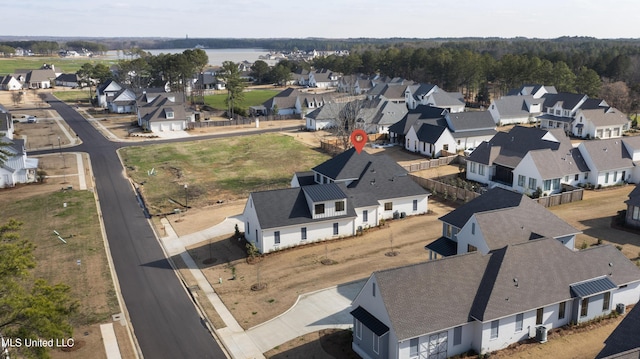 aerial view featuring a residential view and a water view