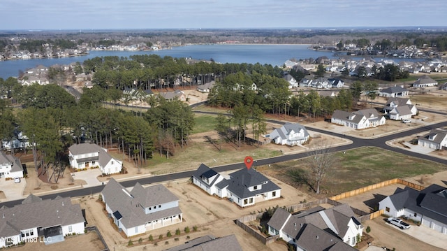 aerial view with a residential view and a water view