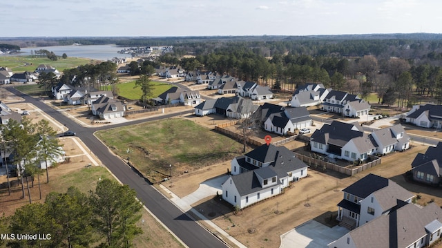 birds eye view of property featuring a residential view and a water view