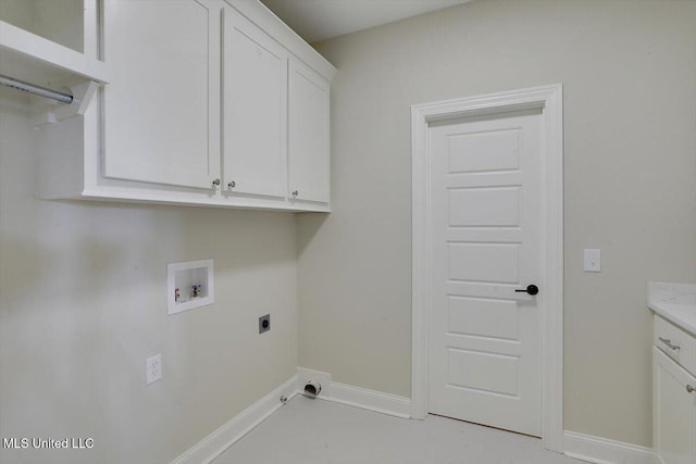 laundry room with hookup for an electric dryer, cabinet space, hookup for a gas dryer, hookup for a washing machine, and baseboards