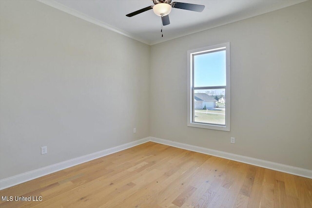 unfurnished room featuring crown molding, light wood finished floors, ceiling fan, and baseboards