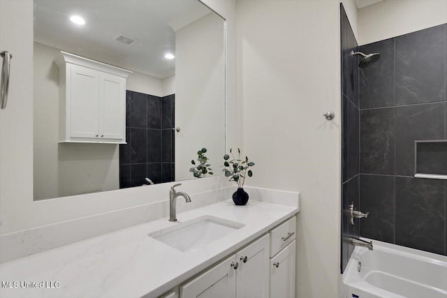 full bathroom featuring recessed lighting, visible vents, washtub / shower combination, and vanity