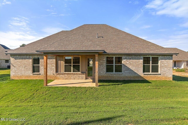 back of property with roof with shingles and brick siding