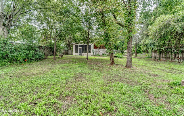 view of yard featuring a sunroom