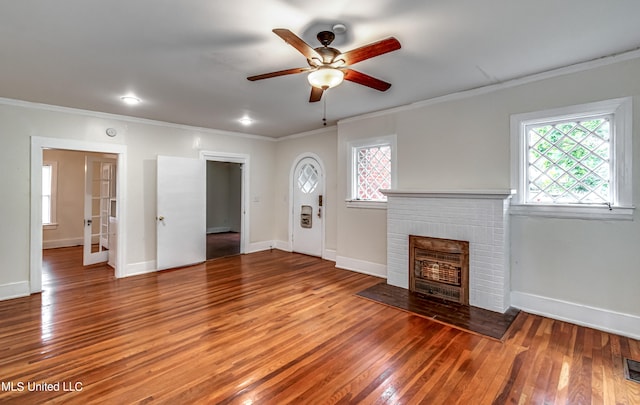 unfurnished living room with ceiling fan, a wealth of natural light, and hardwood / wood-style floors