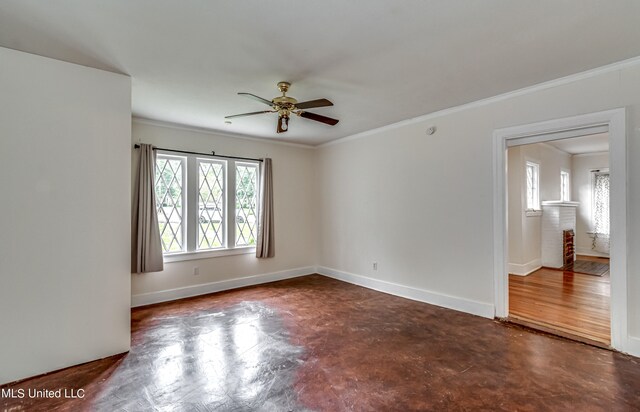 spare room with ornamental molding, dark wood-type flooring, and ceiling fan