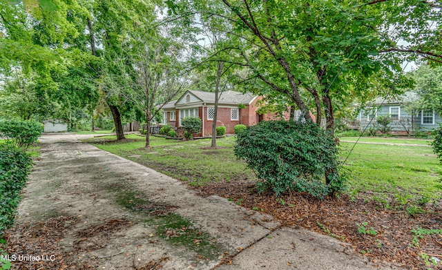 view of front facade with a front yard and a garage