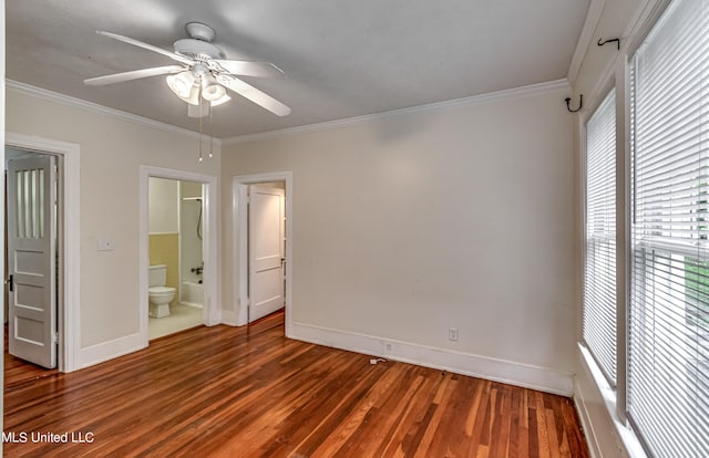 unfurnished bedroom with crown molding and dark hardwood / wood-style flooring