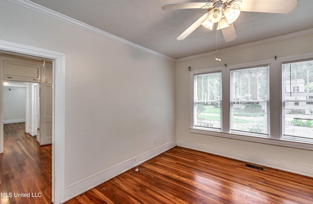 unfurnished room with dark wood-type flooring, crown molding, a healthy amount of sunlight, and ceiling fan