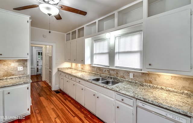 kitchen with sink, backsplash, ceiling fan, white cabinets, and dark hardwood / wood-style floors