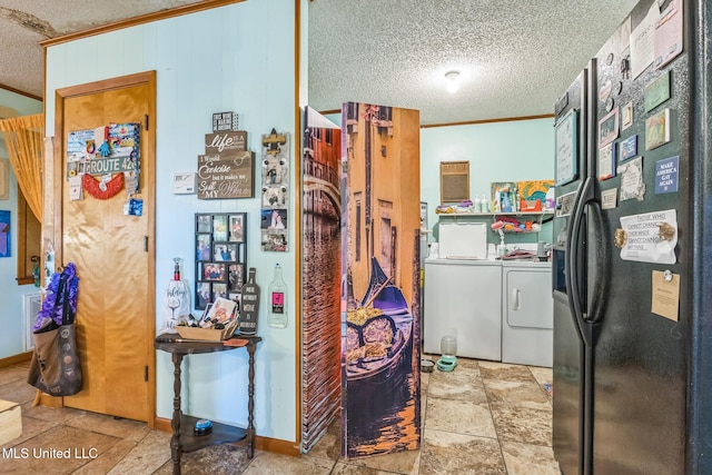 3811 16th St, Gulfport, MS 39501 - kitchen featuring a textured ceiling, ornamental molding, separate washer and dryer, black fridge with ice dispenser, and stone finish flooring