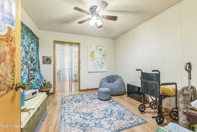 3811 16th St, Gulfport, MS 39501 - sitting room with a textured ceiling, wood finished floors, and ceiling fan