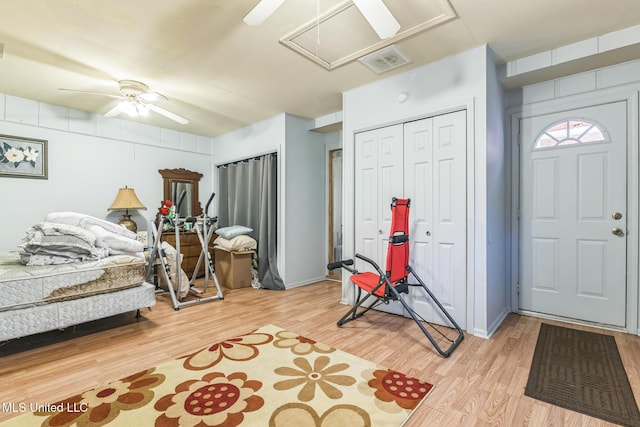 3811 16th St, Gulfport, MS 39501 - bedroom with attic access, light wood-style floors, a closet, and ceiling fan