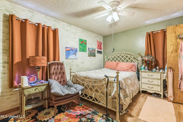 3811 16th St, Gulfport, MS 39501 - bedroom with a textured ceiling, wood finished floors, and a ceiling fan