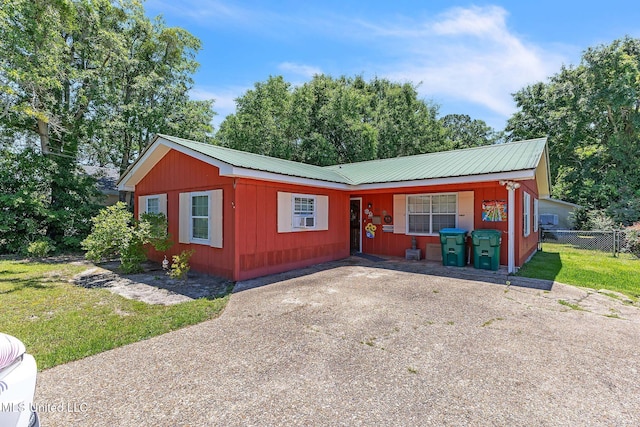 3811 16th St, Gulfport, MS 39501 - view of front of house featuring metal roof and driveway