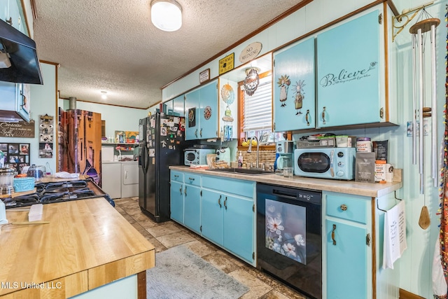 3811 16th St, Gulfport, MS 39501 - kitchen featuring a sink, black appliances, blue cabinetry, a textured ceiling, and washing machine and clothes dryer