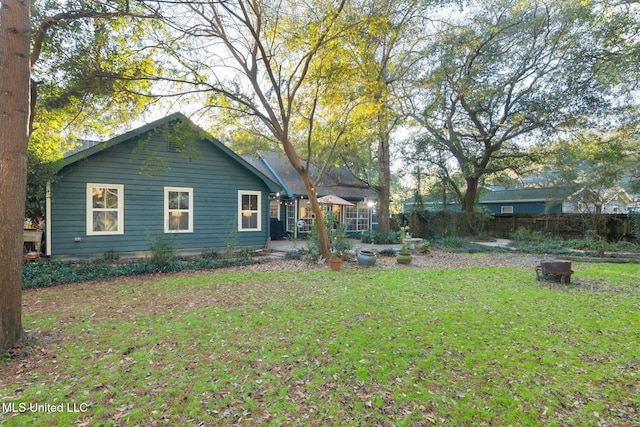 exterior space featuring an outdoor fire pit