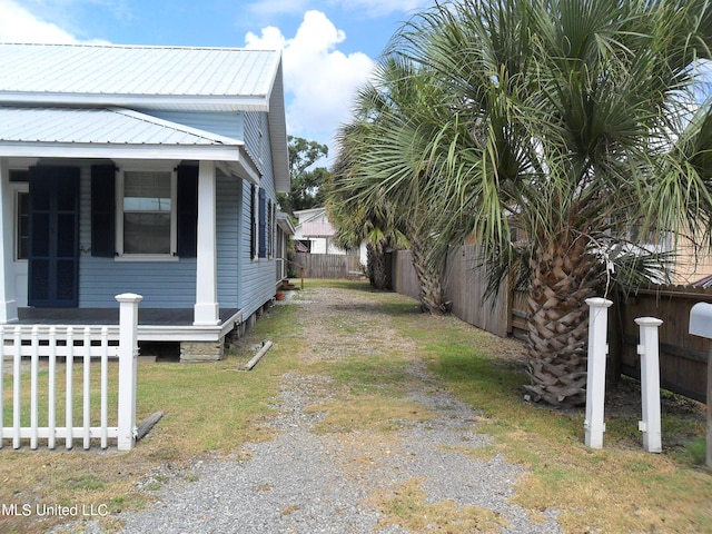 view of property exterior featuring a lawn